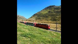 Glacier Express at Oberalp Pass in Swiss Alps Matterhorn Gotthard Bahn [upl. by Enneirb]