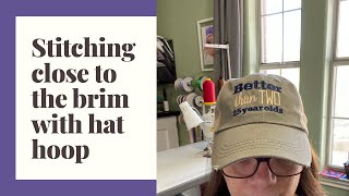 Stitching close to the brim of a hat with a brother hat hoop [upl. by Suirtimid]