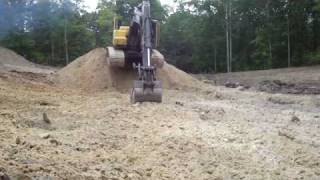 Excavator Climbing Down A Stockpile [upl. by Elocaj]