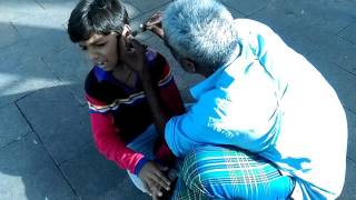 Ear Cleaners Removing paper from a childs ears [upl. by Hgiellek]