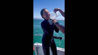 Woman Wearing a Snappy Tight Wetsuit and with Hot Water Poured into Her Tight Wetsuit [upl. by Necyrb979]