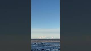 As Morning Moon Looms Over Alaska’s Cook Inlet Mount Susitna and Alaska Range Appear Below [upl. by Eissahc]