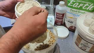 Showing how to mix diatomaceous earth with chicken feed [upl. by Kared]