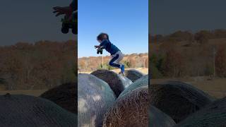 Jumping Hay Bales On The ranch shorts haybales farmfun farmboy parkour ranch [upl. by Aisayt]