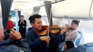 Professional violinist gives performance for passengers on delayed flight [upl. by Liss]