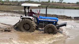 New Holland 3630 Special Edition 4x4 Tractor Puddling in Mud Eicher 485 Tractor Pushing Mahindra [upl. by Notnilk]