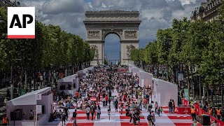 The ChampsÉlysées in Paris is transformed into a massive table for a special picnic [upl. by Kaltman934]