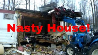 LS Tractor tearing down a hoarders house and hauling away junk scrap metal [upl. by Rebekkah]