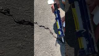 Filling Cracks In Asphalt Driveway [upl. by Lenod]