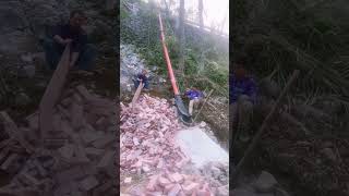 The process of unloading bricks down the hillside [upl. by Ahsiema]