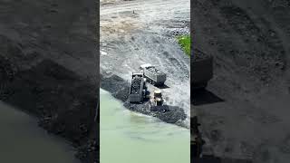 Action Machinery dump truck and Bulldozer moving the rock into water dumpers [upl. by Harrow440]