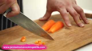 Chopping a carrot  Jamie Olivers Home Cooking Skills [upl. by Ahsiya]