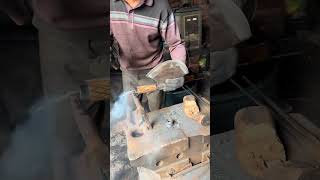 The blacksmith is installing the handle on the bone chopping knife [upl. by Ainosal790]