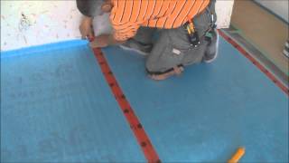 Installing the Underlayment for Laminate Flooring Installation on Wood Mryoucandoityourself [upl. by Reinhold]