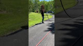 Spraying on driveway sealer with no trim board sealcoating drivewaysealing spray cuttingin [upl. by Ardnoed]