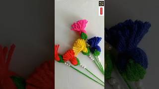 beautiful yarn flower key chain making Using comb shorts [upl. by Ariahaj931]