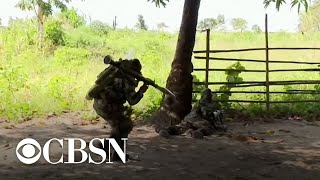 City in Mozambique under siege from militants linked to ISIS [upl. by Ailahs817]