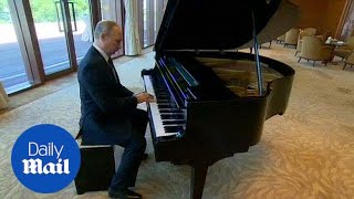 Putin on a show Russian president shows off his piano skills  Daily Mail [upl. by Nipahc]