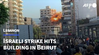 Moment Israeli strike hits building in Beiruts southern suburbs  AFP [upl. by Ayalahs]