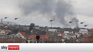 Russian helicopters circle Kyiv and tanks cross the Belarus border into Ukraine [upl. by Osmen]