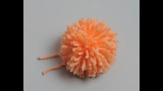 How to Make a Pom Pom Using a Piece of Cardboard [upl. by Limemann794]