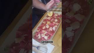 carpaccio is a dish served raw with oliveoil lemon parmigianoreggiano olioextravergine limone [upl. by Goldston]