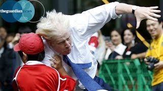 Boris Johnson knocks over boy in rugby match in Japan [upl. by Eninaej519]