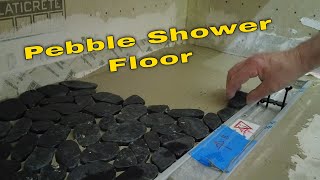 Black pebble tile shower floor Install [upl. by Llenrod]