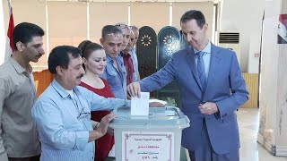 Syrias Assad casts his ballot in parliamentary poll  AFP [upl. by Lias621]