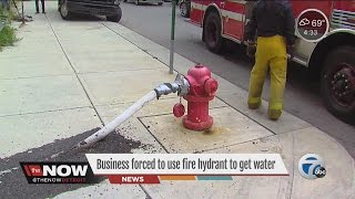 Business uses fire hydrant to get water [upl. by Enomrej363]