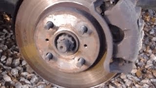 How to change front brake pads Toyota Corolla Years 19952010 [upl. by Healion]