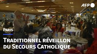 À Paris le Secours Catholique organise un réveillon pour les plus démunis  AFP [upl. by Schwejda]