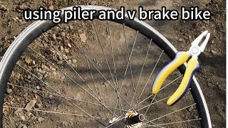 how to true a wheel without truing stand and special tools with just using v brake bike and piller [upl. by Karli]