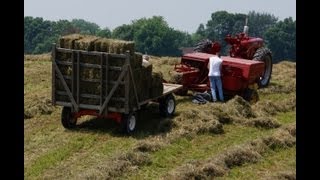 Baling Hay with Farmall Super M amp 276 Hayliner New Holland [upl. by Collete]