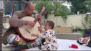 Feng Tian Zhongruan and son playing Chinese banjo “Yueqin” PRC China [upl. by Aleemaj]