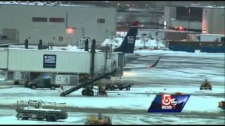 Plane hits deicing truck at Logan [upl. by Kcirtapnaes]