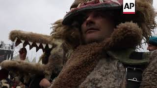 Bulgarian folk performers dress in vibrant costumes for masked festival [upl. by September]