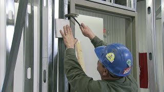 How to Install a Steel Door Frame in Steel Stud Construction  Steel Door Institute [upl. by Kilbride342]