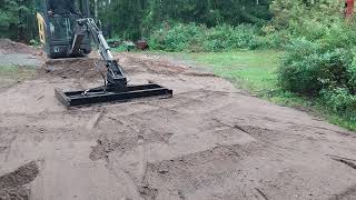 Volvo mini excavator with homemade grading beam [upl. by Mond]