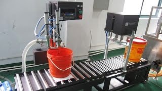 20L lubricant oil bucket filling capping machine automatic line manual caps feeding big container [upl. by Elleiand]