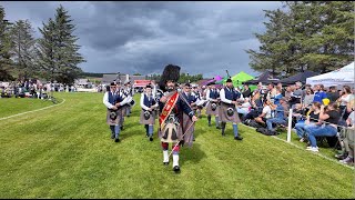 Drum Major Dyer leads Aberlour Pipe Band playing on the march during 2024 Dufftown Highland Games [upl. by Nnod]