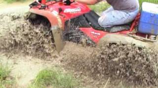 Windrock Mudding 8210 King Quad 700 with 28quot Outlaws [upl. by Yatnuhs]