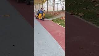 The process of clearing fallen leaves on sidewalks with high pressure water guns [upl. by Llertnauq417]