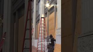 Local businesses are boarding up their windows in preparation for election day [upl. by Auqinimod908]