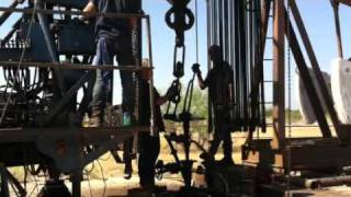 Oil field pulling unit wrenching rods [upl. by Monteria]