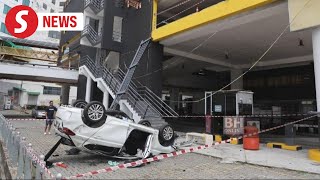 Car plunges through firstfloor parking barrier at Seremban Terminal 1 [upl. by Enyrb]