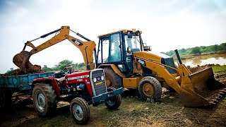 cat machine loding tractor Massey Ferguson [upl. by Lebezej]