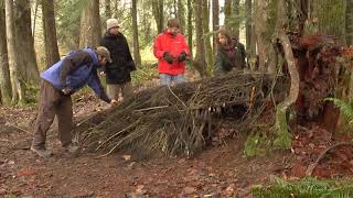 Debris Hut Wilderness Survival Shelter Demonstration [upl. by Anah205]