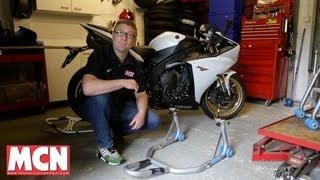 How to Use a paddock stand  Products  Motorcyclenewscom [upl. by Wasserman905]