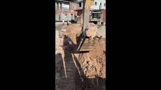 Excavator building a riverside road [upl. by Jammin]